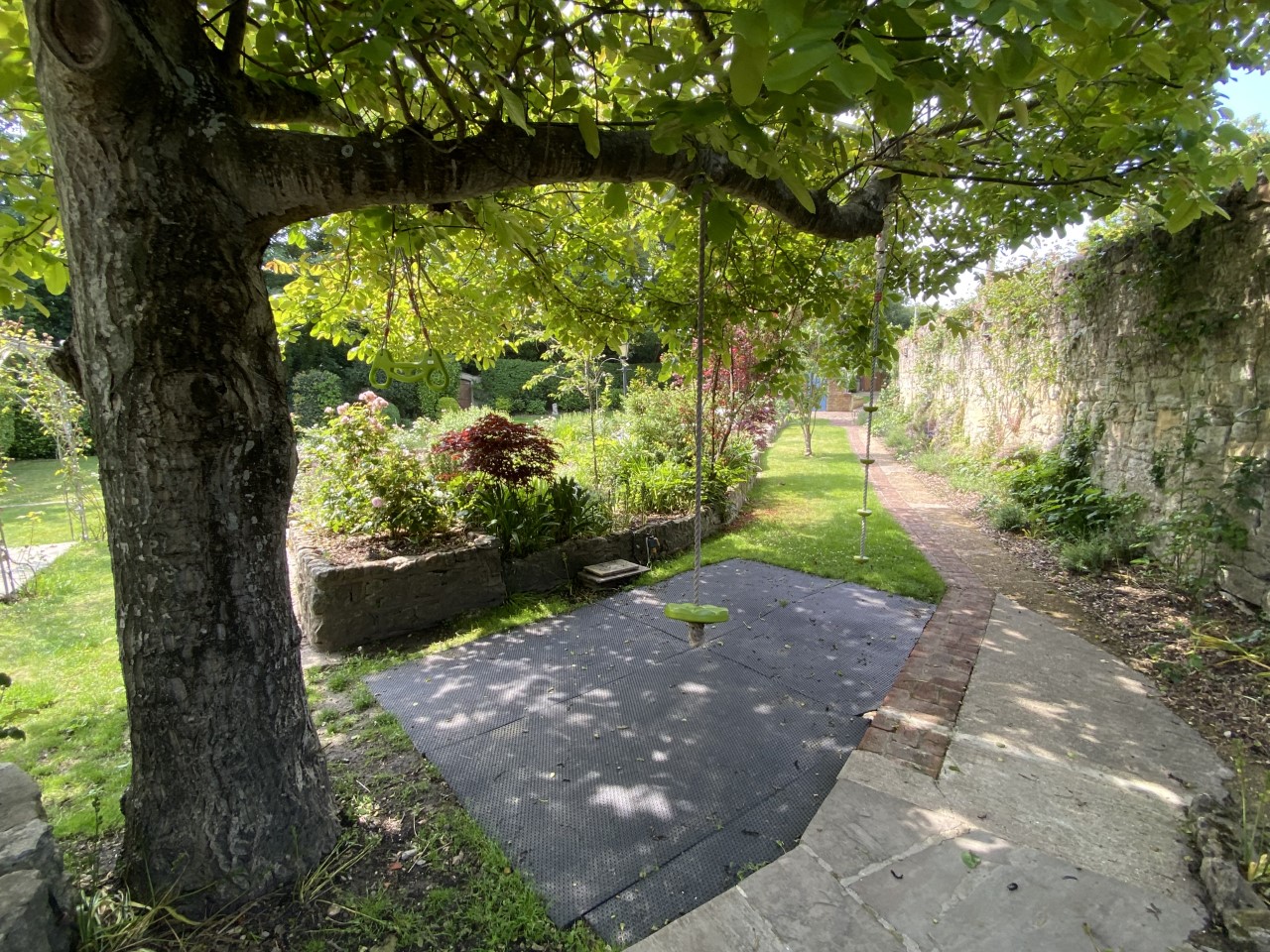 Kids love playing on rope swings in our secure gardens